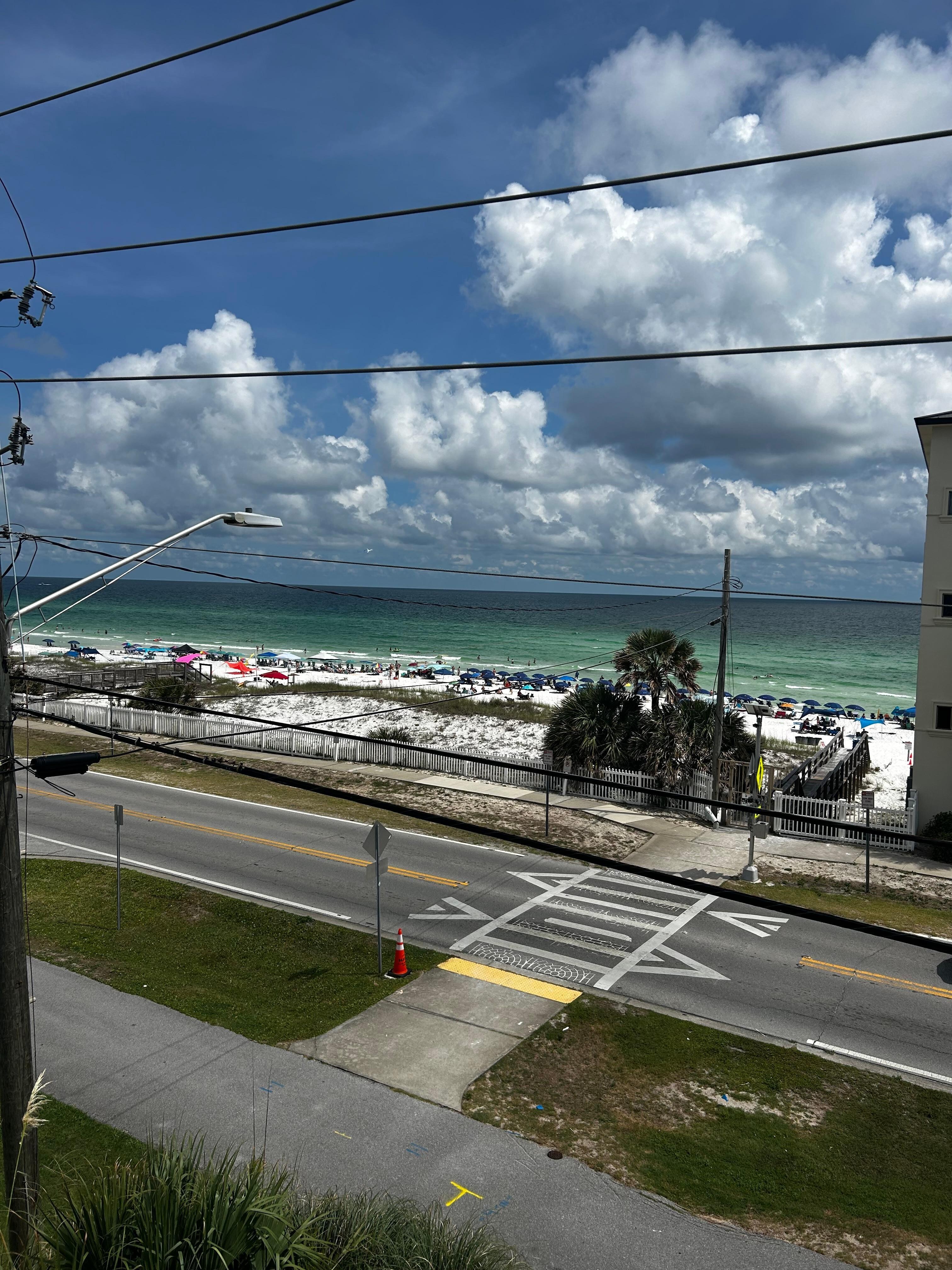 View from the 2nd floor balcony, beach access right across the crosswalk. 