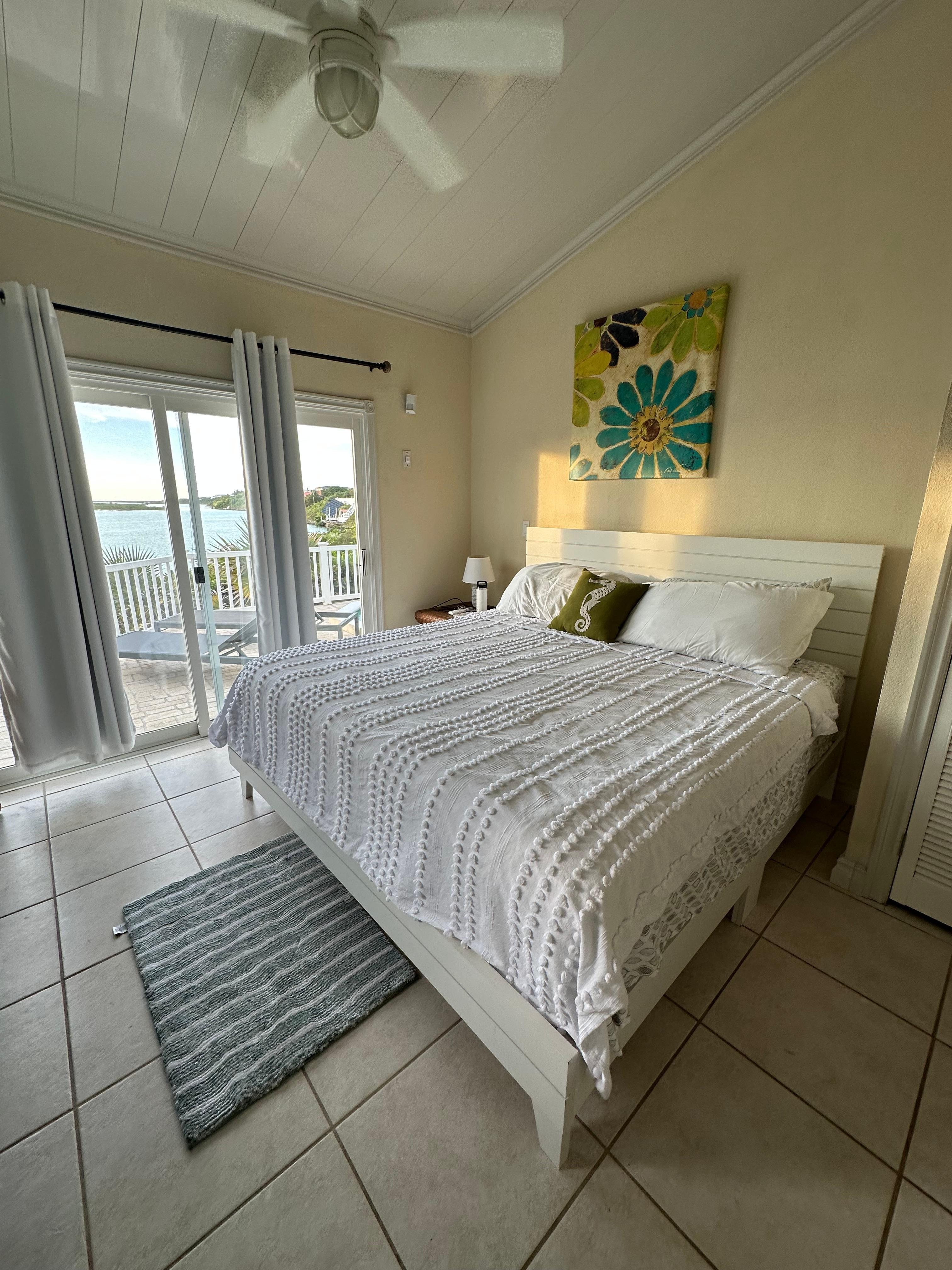 One of the 2 bedrooms with a patio door directly to the pool. 