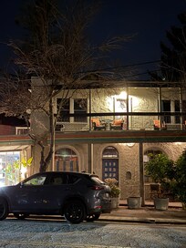 Front of hotel. dal Evan’s room top left with balcony