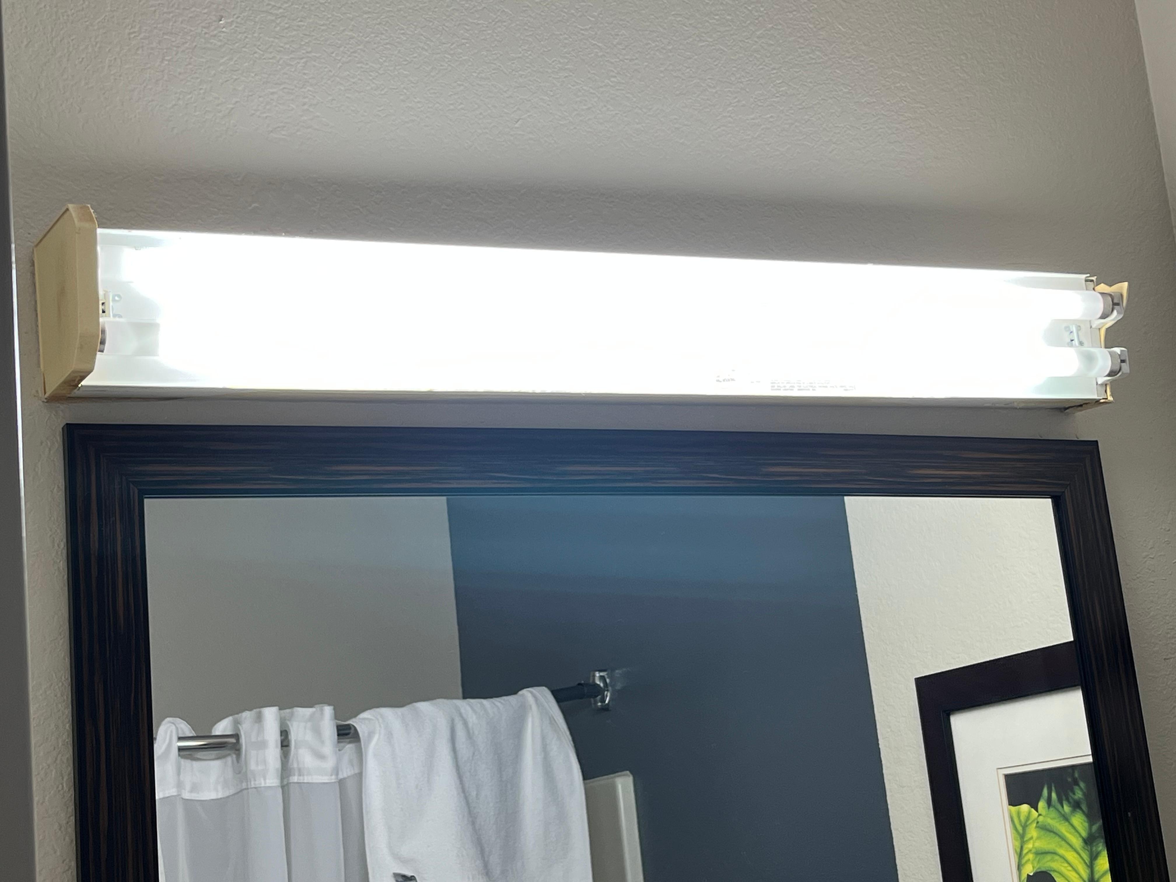 Bathroom neon lights exposed/no shade