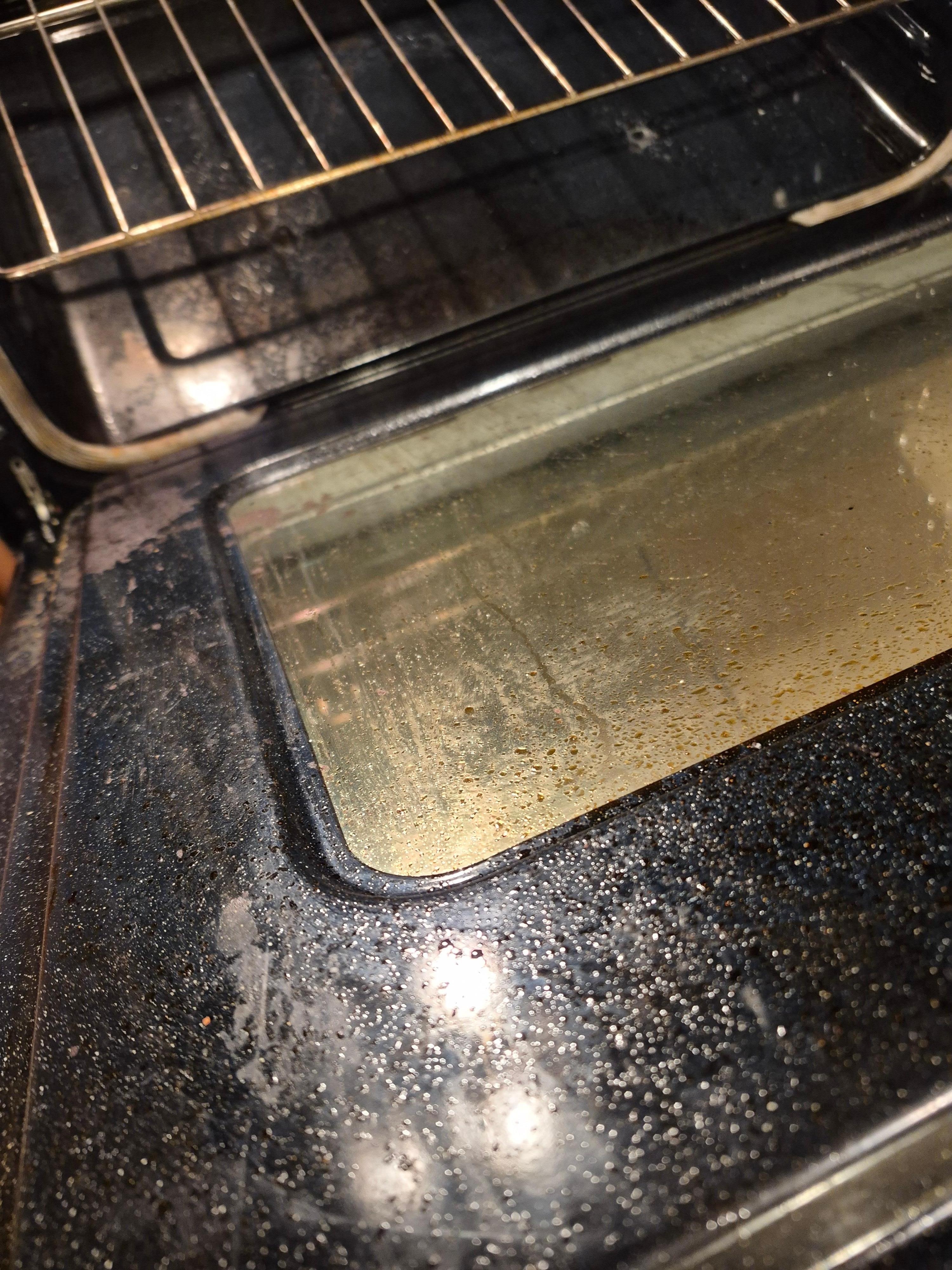 Kitchen oven with accumulated "gunk" from previous renters.