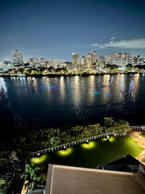 View from balcony at night overlooking the pool and lagoon.