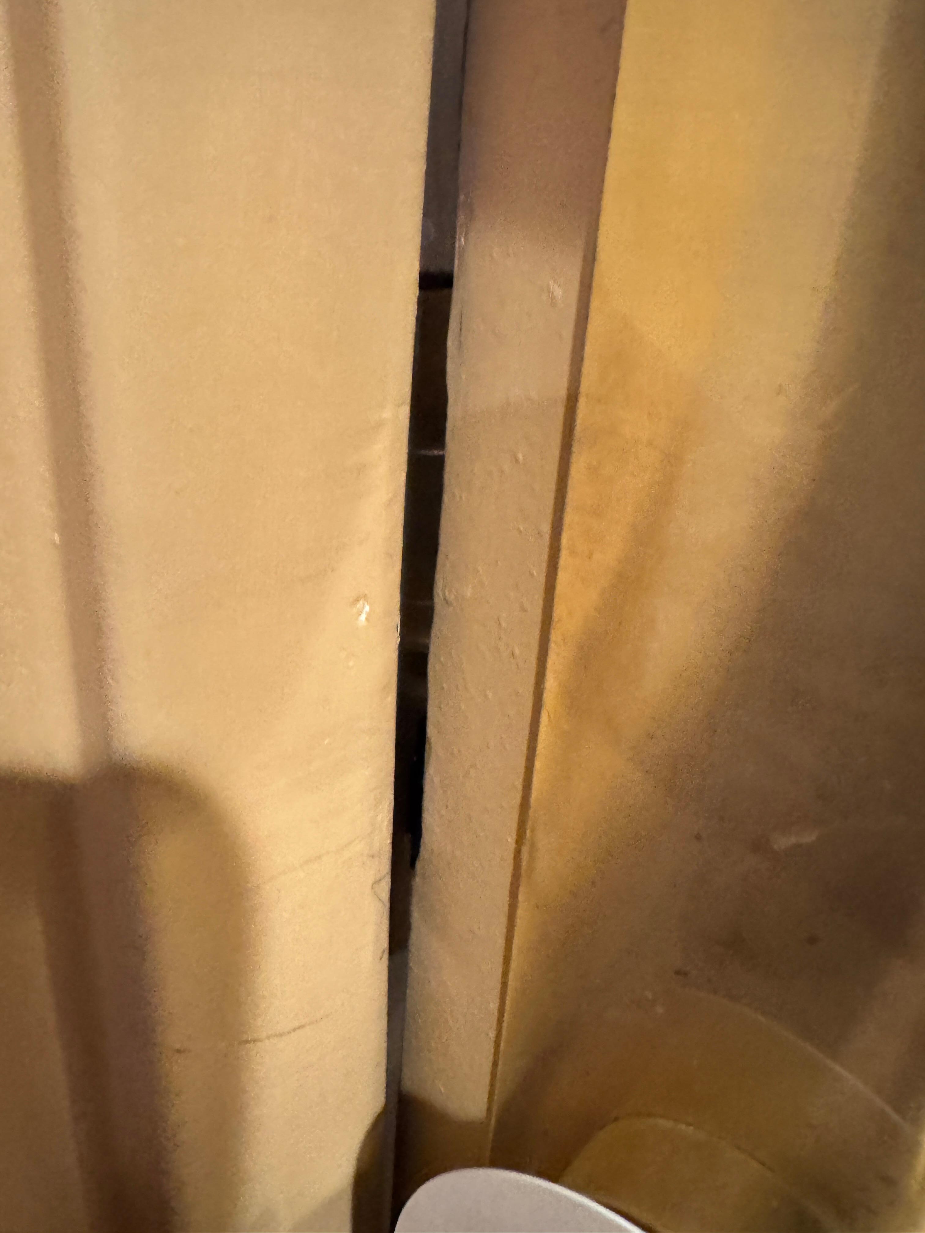 Door frame bent. Door easily opened with any kind of card by just popping it in. We had to switch rooms as a result. We saw rooms all down our hallway with door frames like this.