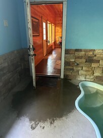 Standing water due to leak in LIGHT FIXTURE (from kitchen sink/dishwasher on floor above)