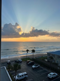 From our balcony; view of street & partial beach; both beautiful!