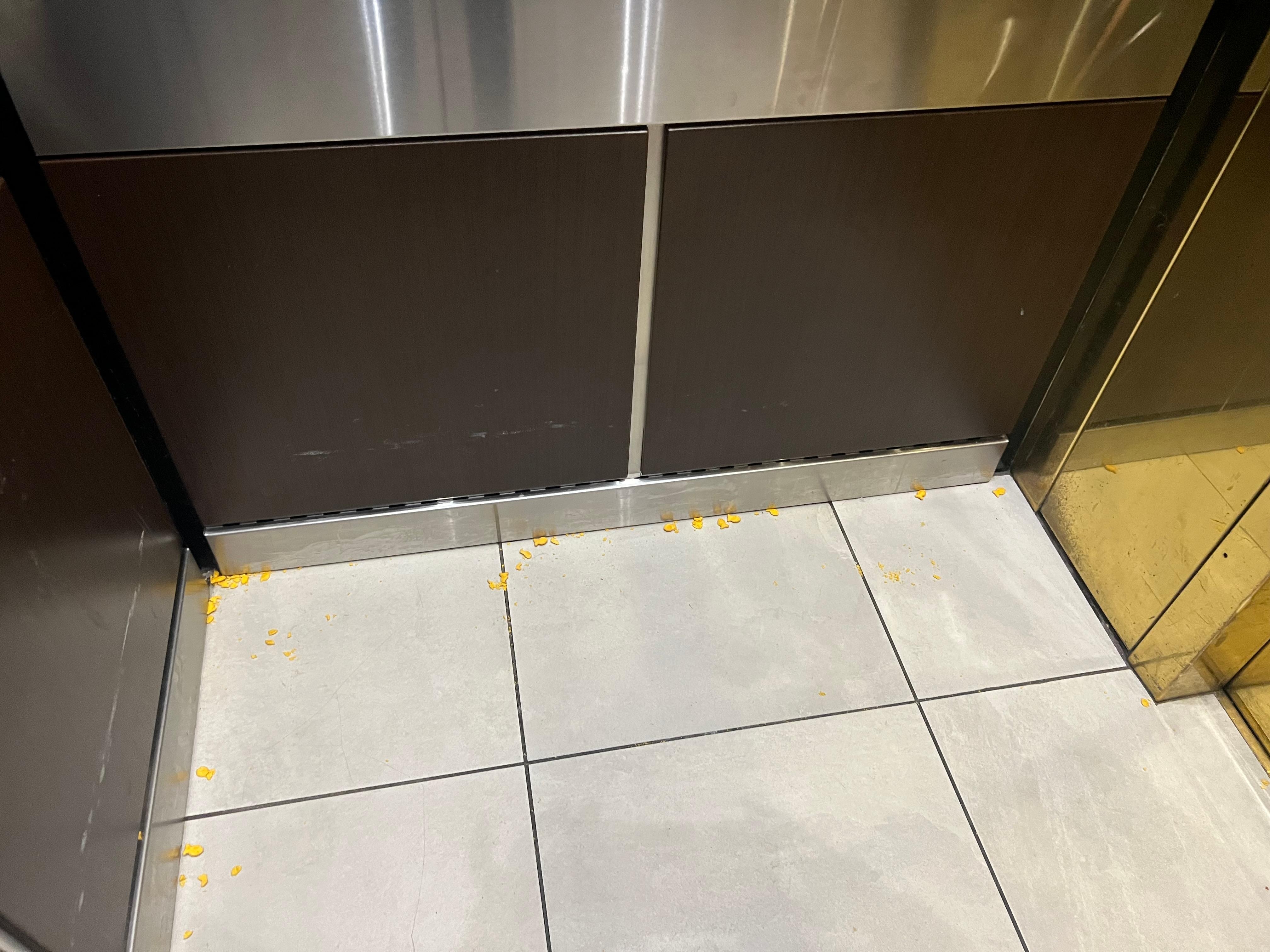 Cheese nips purposely spread around the elevator.