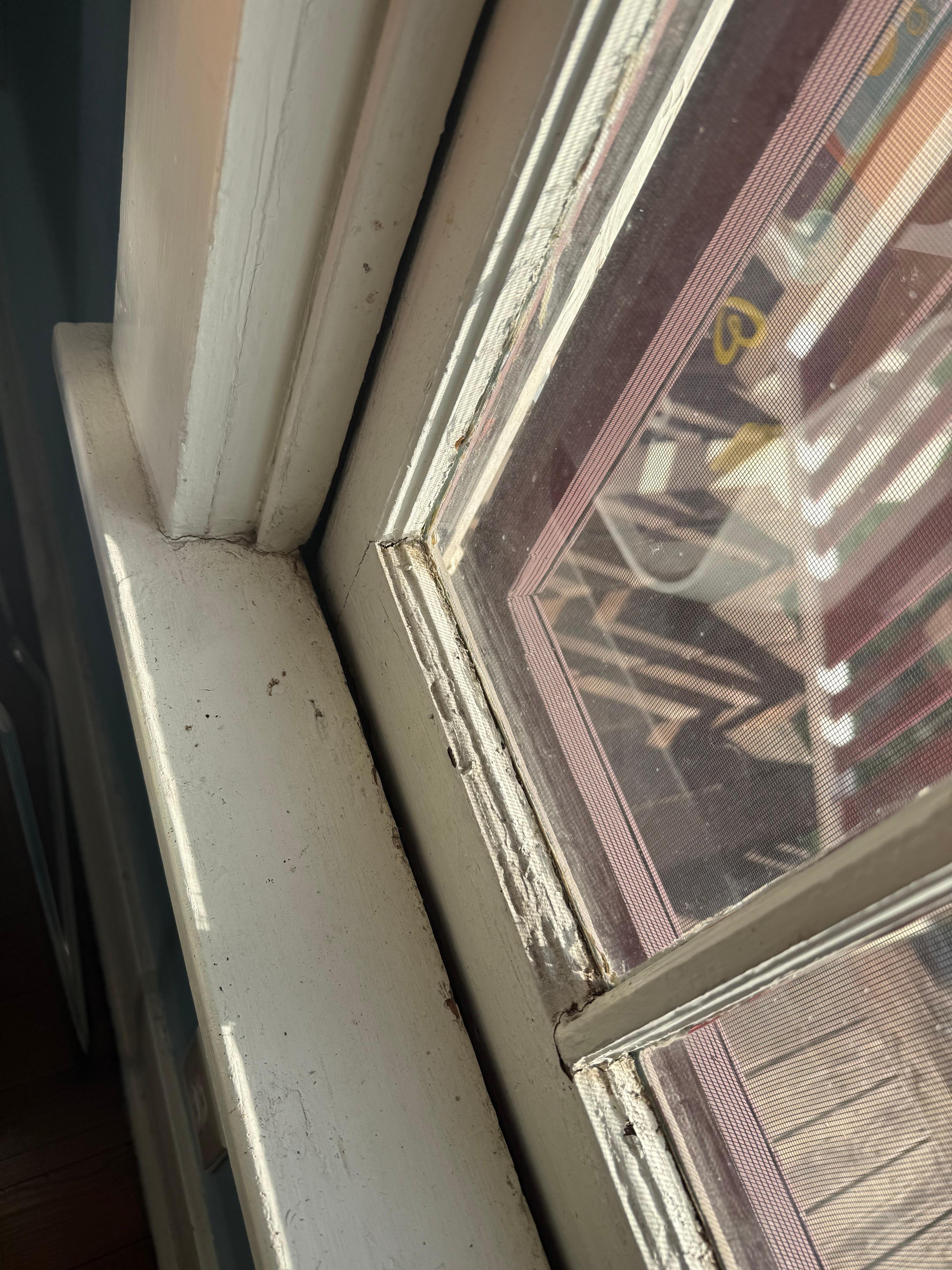dirty windowsill with peeling paint