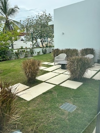 Side patio provides space to relax in solitude.