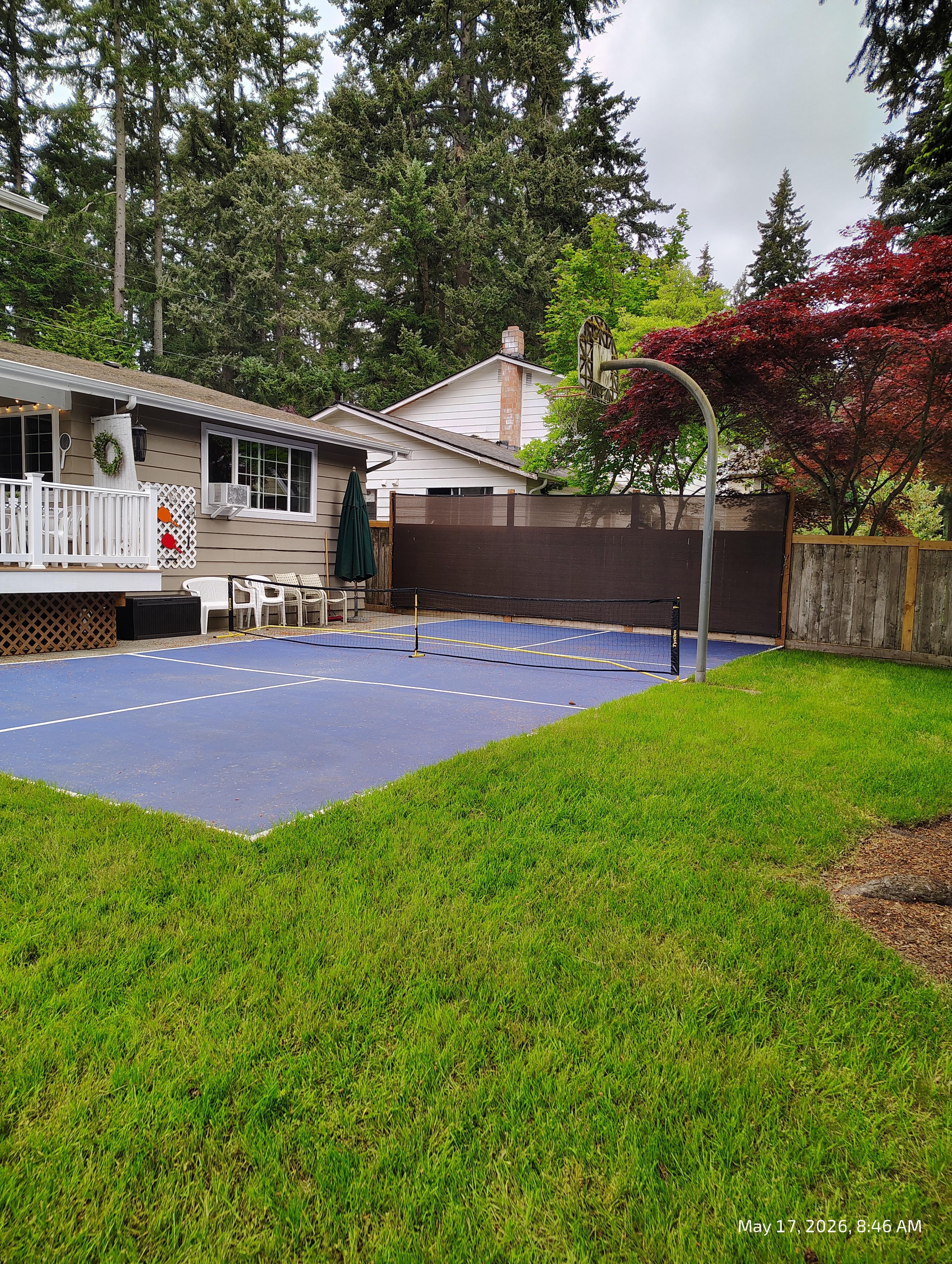 Outside backyard! Pickle ball and basketball hoop made our two grandsons very happy! All the equipment was there to play too! 