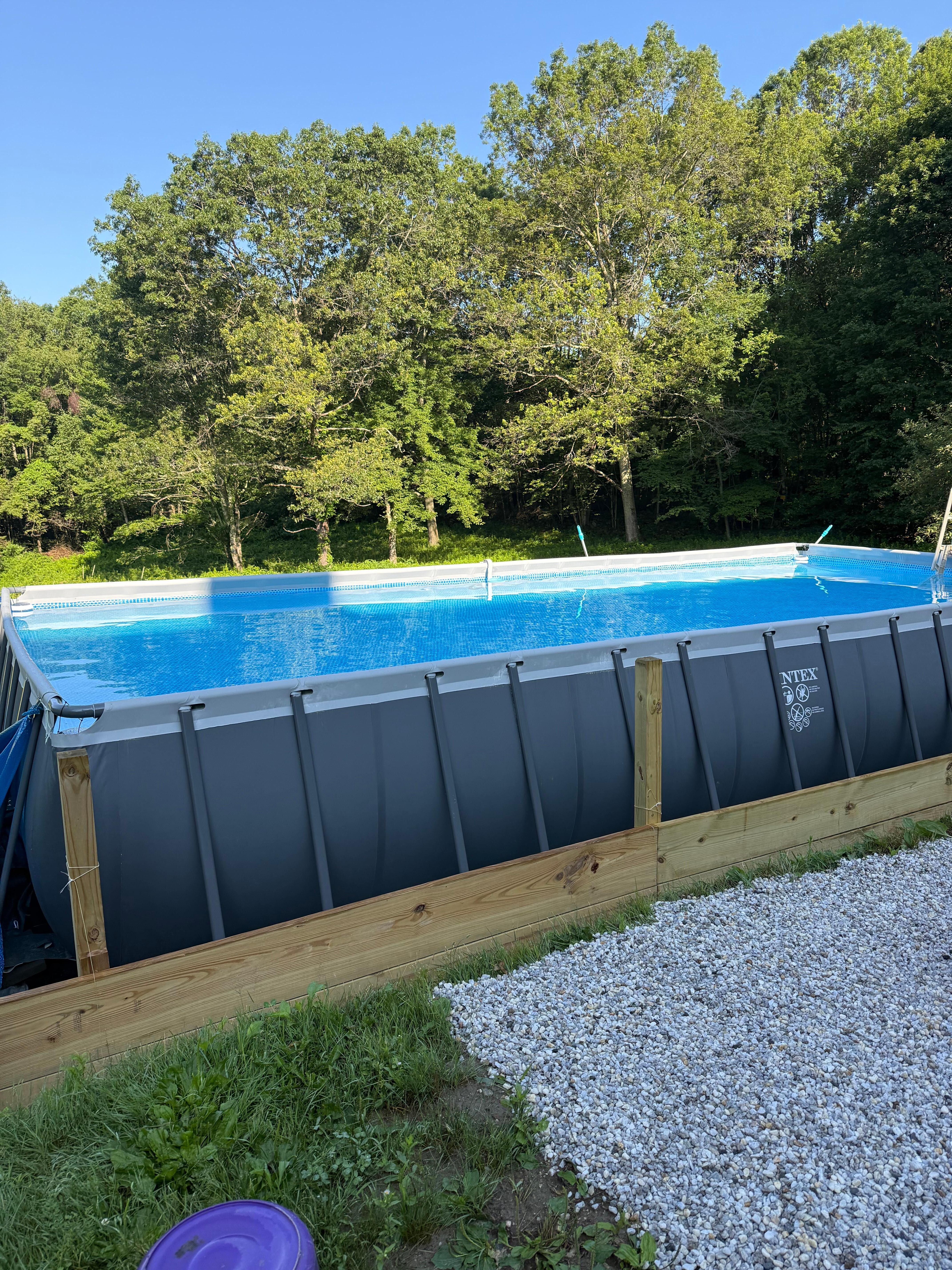 Pool with ditches around .
