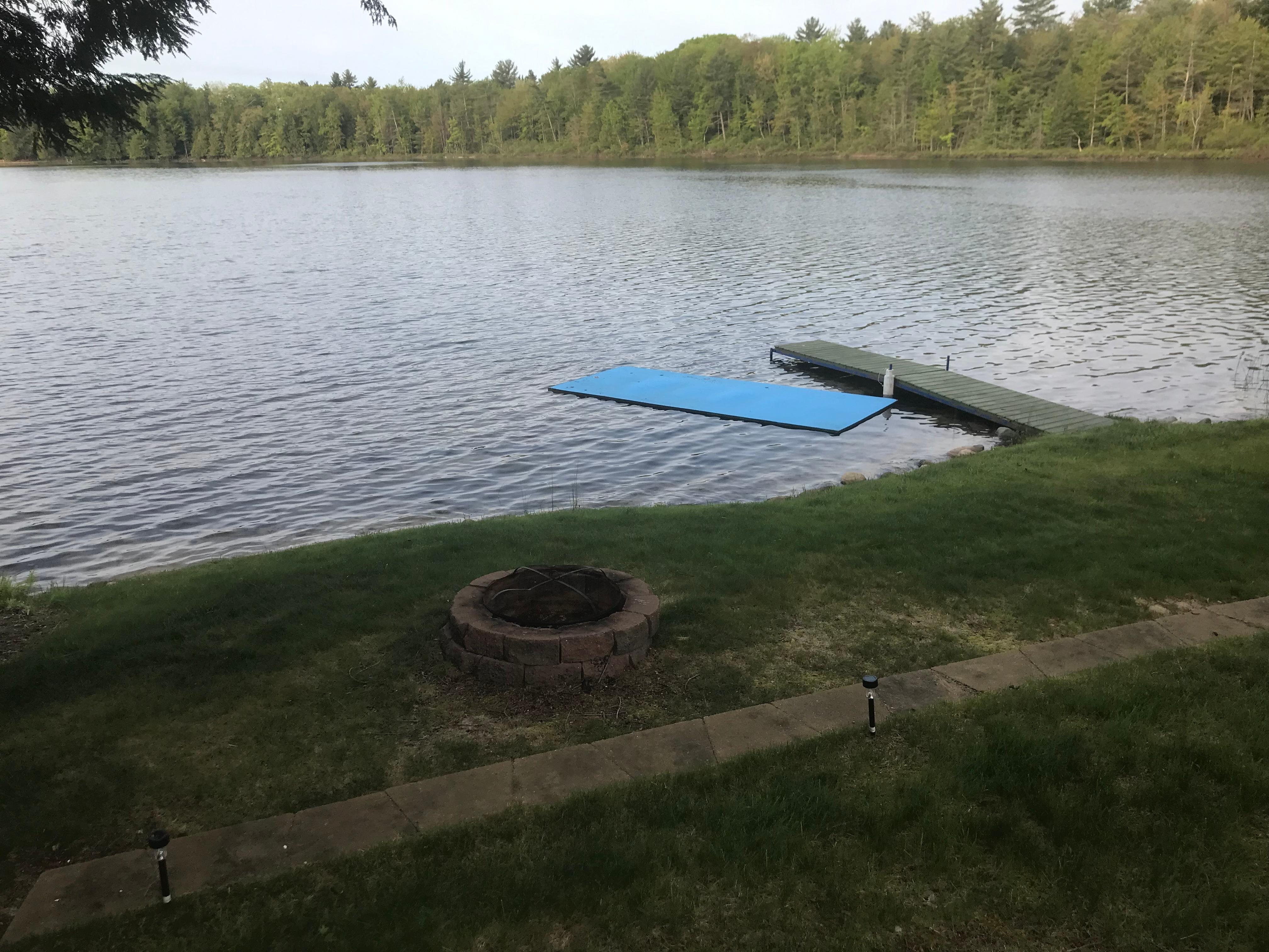 Dock, swimming float thing, and fire pit.