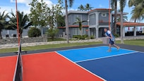 Pickle ball court and beach house view.