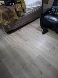 There were no rugs on the floor. I know this makes for easy clean up but the bare floor was cold. The blanket on top of the bed was very thin and cheap material