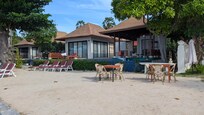 Remove these unused huts and put in place an infinity pool with a decent bar/restaurant. Leave plenty of area for sunbeds!