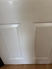 Dirty splashes on the bedroom door