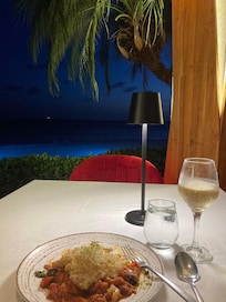 Delicious halibut with roasted vegetables and mashed potatoes at The Red Parrot at the Divi. The waiter was excellent as well!