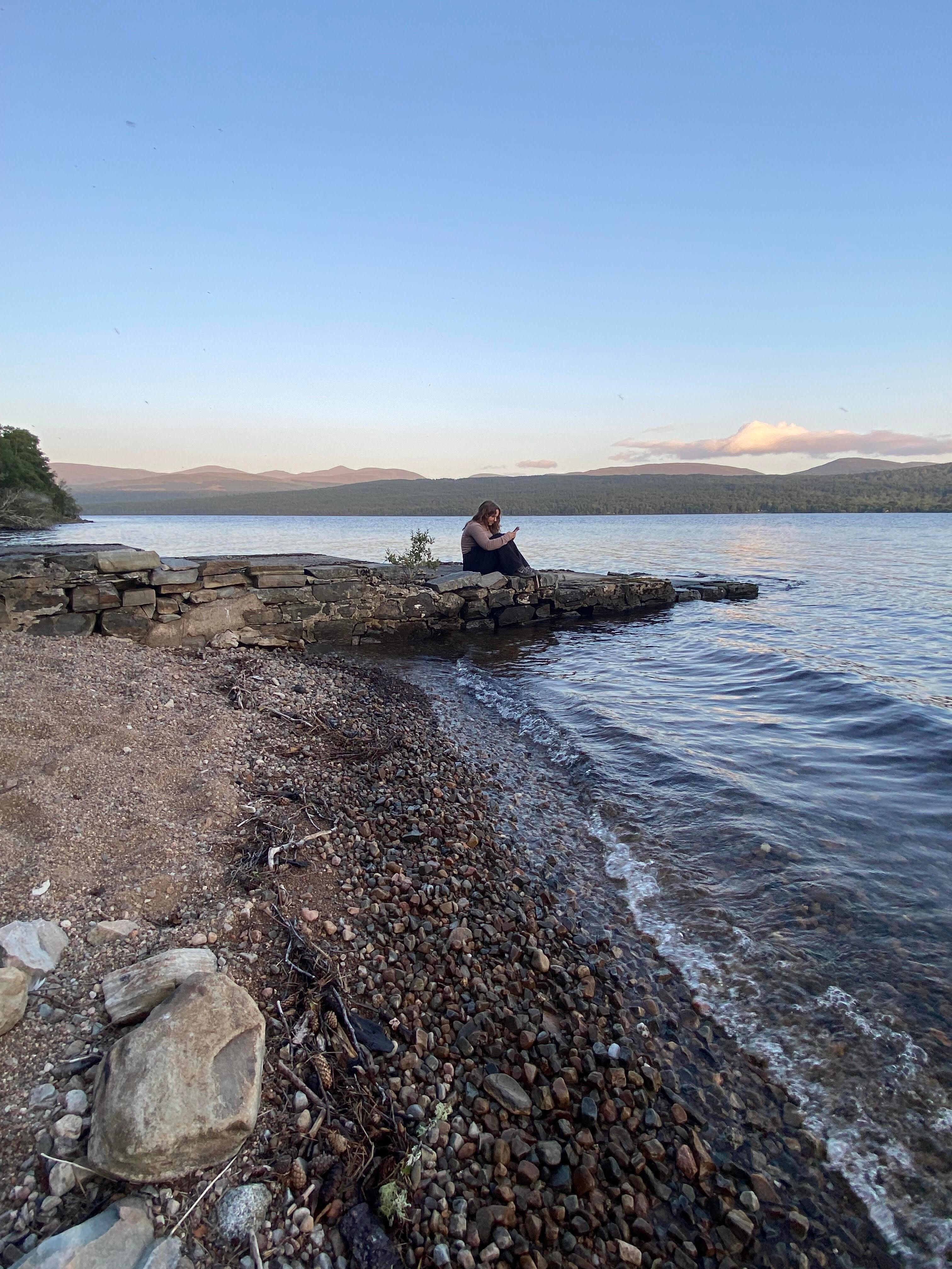 The beach at the loch by sunset.