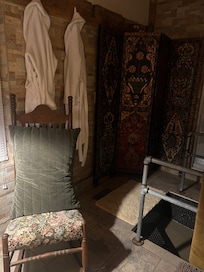 Plush robes and the coolest step down tiled shower