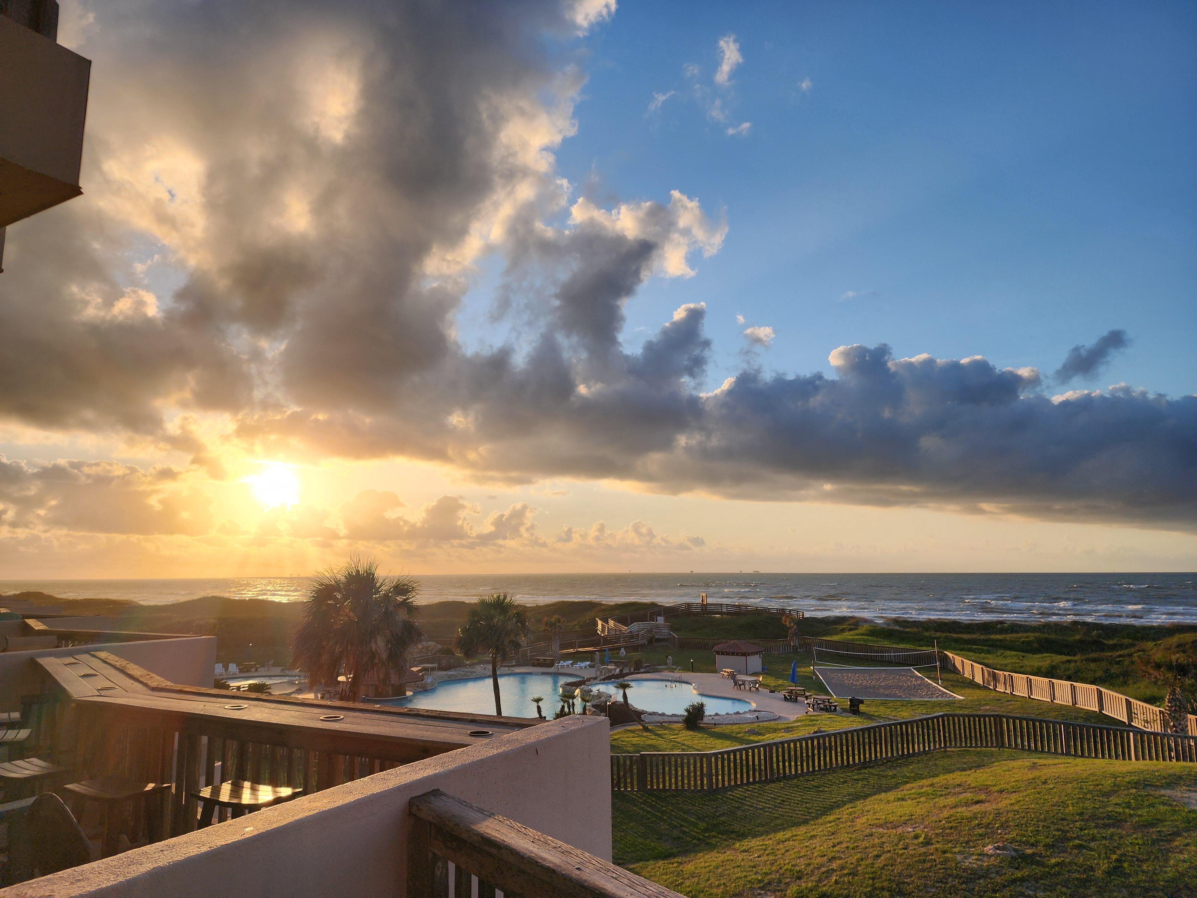 Morning view looking over the pool area into the surf