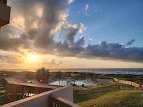 Morning view looking over the pool area into the surf