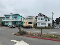 From across the street - yellow front door