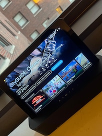 Tablet in the room with welcome greeting, book attractions, Bluetooth speaker & more