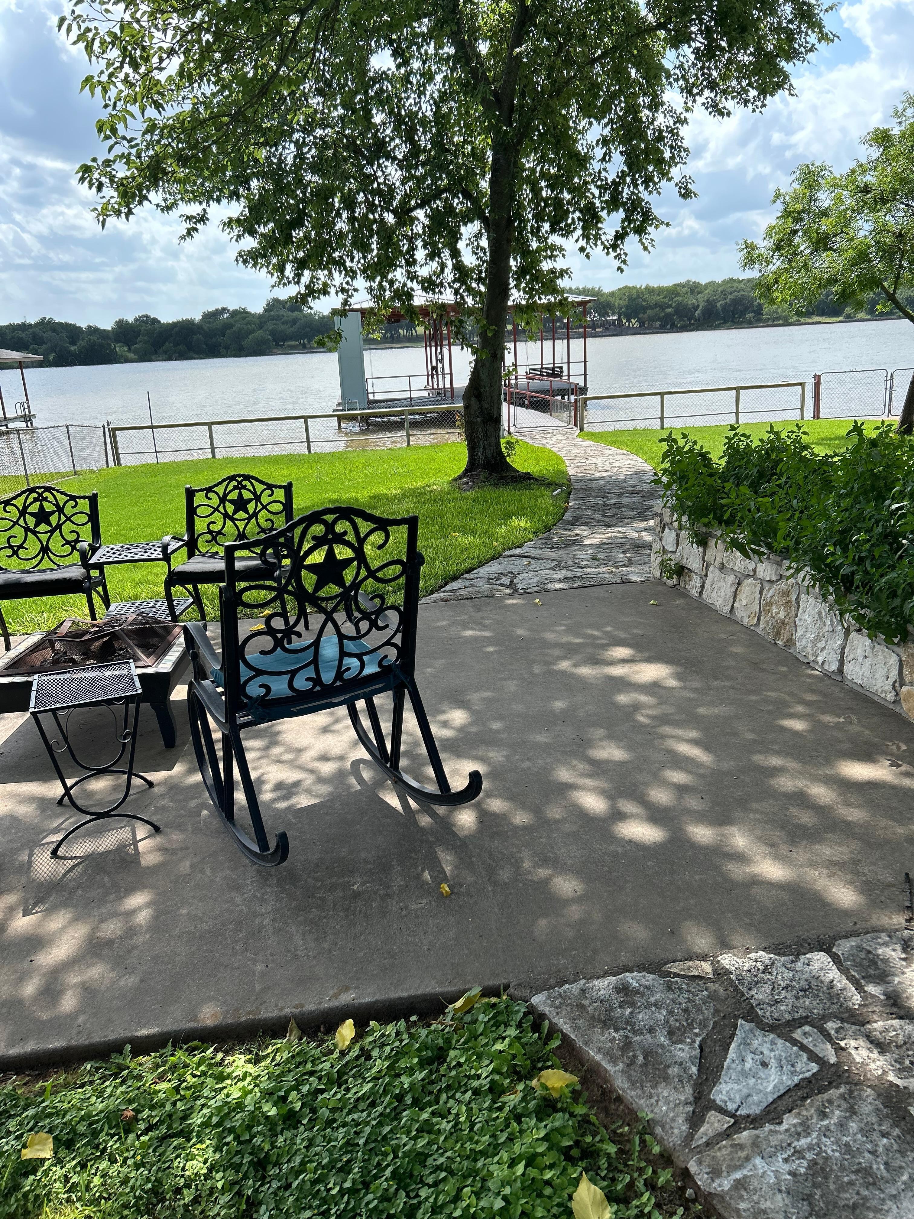 Coffee every morning from this little patio beneath the tree.