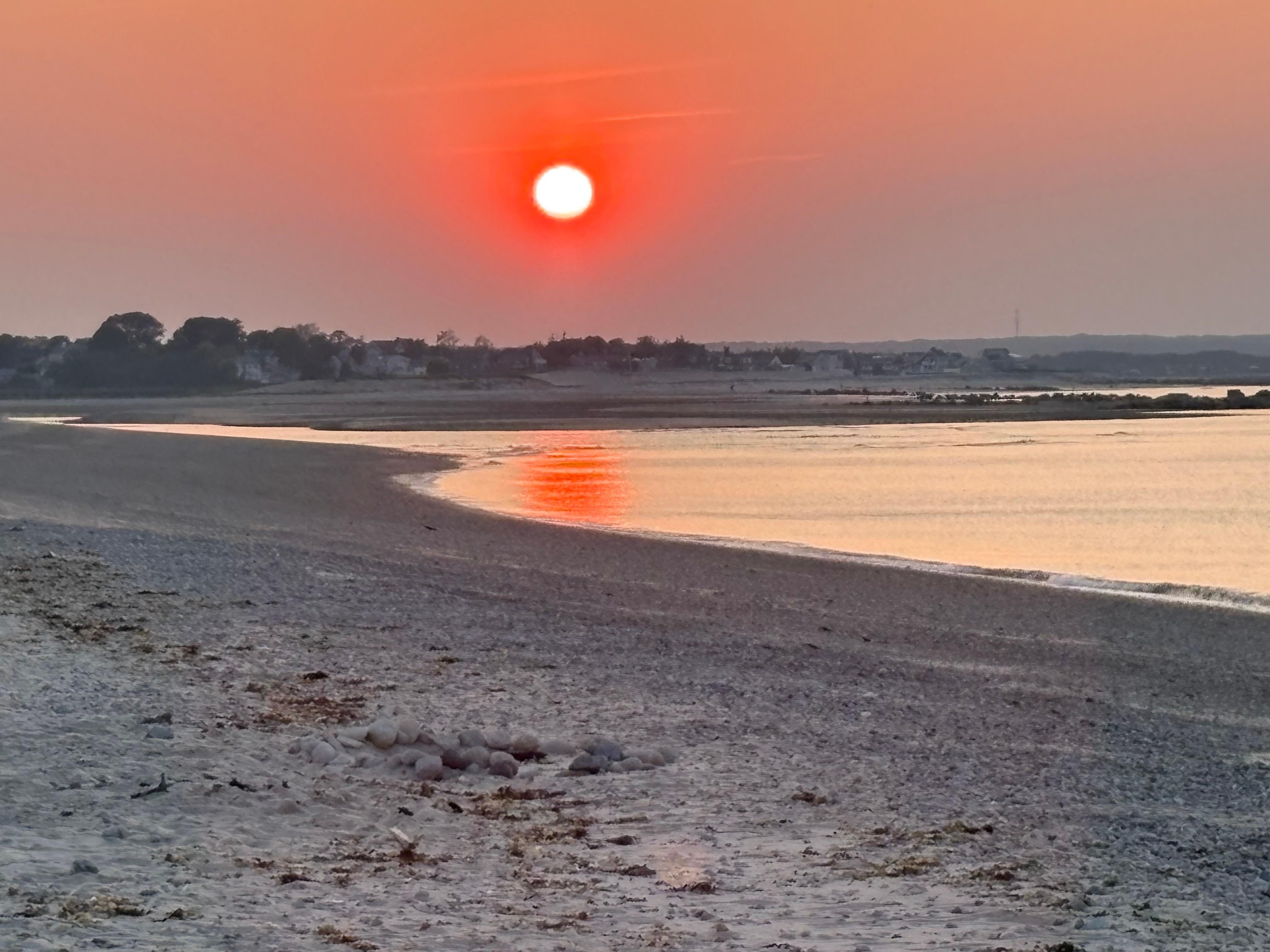Sunset walk along quiet, private beach 