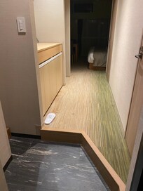 Charming room-entry with slippers waiting.