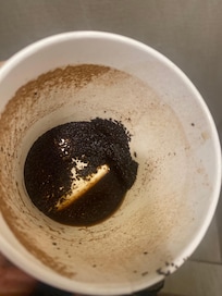 Coffee grounds in cup