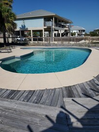 pool dirty not on and cement around pool buckling up with extreme weather splintered deck.