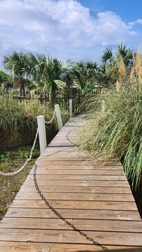 Walkway from condo to beach, pier, and pool.