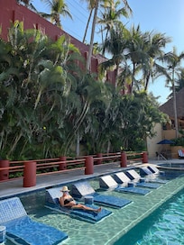 Pool loungers in the water