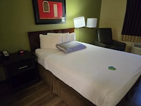 Comfy queen size bed with three pillows