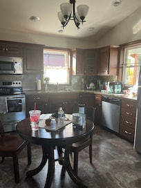 The kitchen area of the blue house.