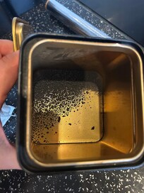 Coffee offering was blackened, dried out, stale remnants of instant coffee at the base of a tin.