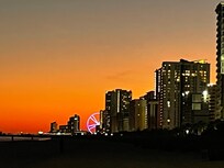 View of Ferris wheel from beach.