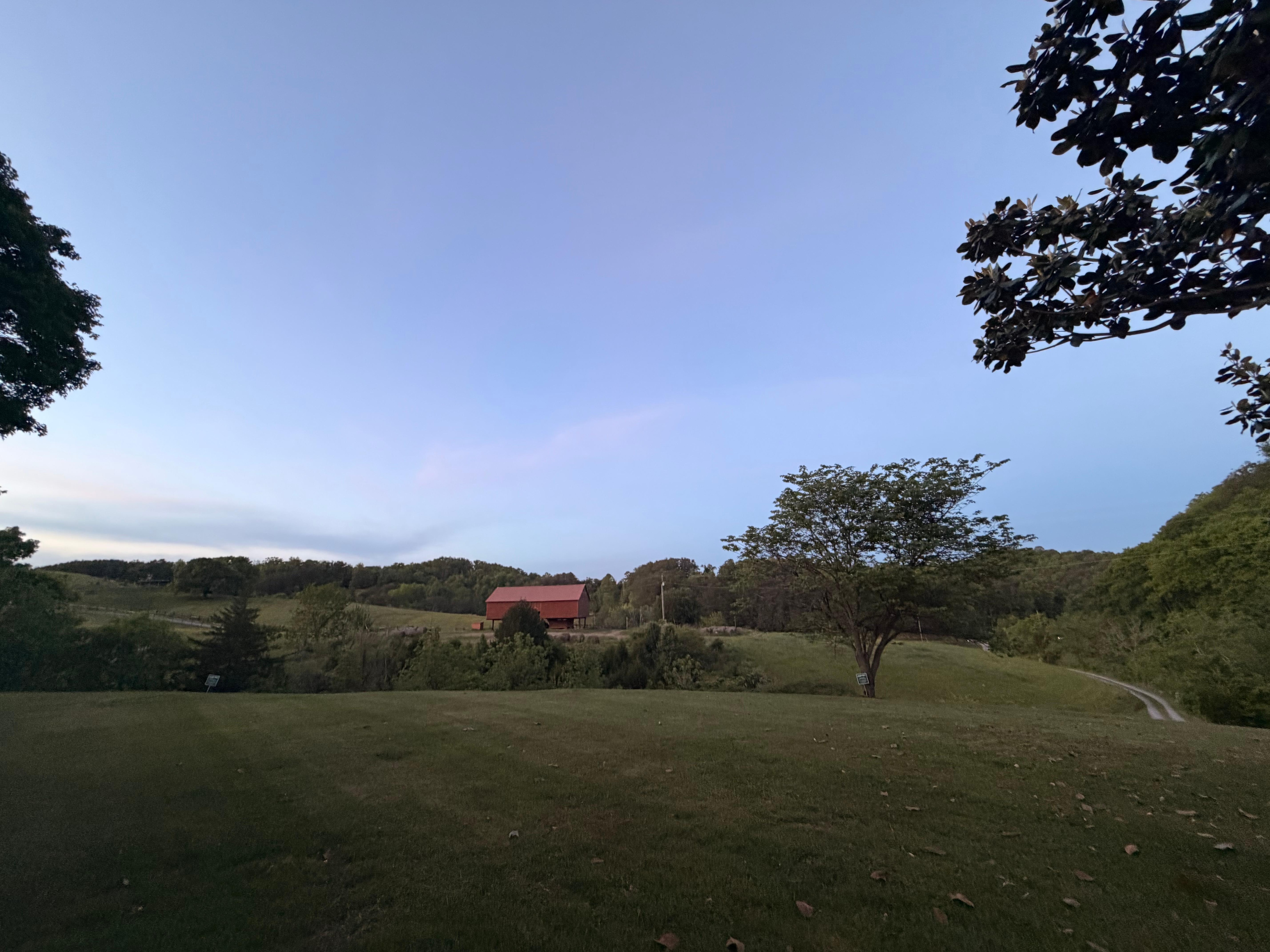 Front yard view. 
The road is out front but you can’t hear traffic because the home is set back and up from the road a bit. 