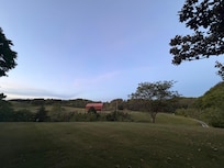 Front yard view.
The road is out front but you canât hear traffic because the home is set back and up from the road a bit.