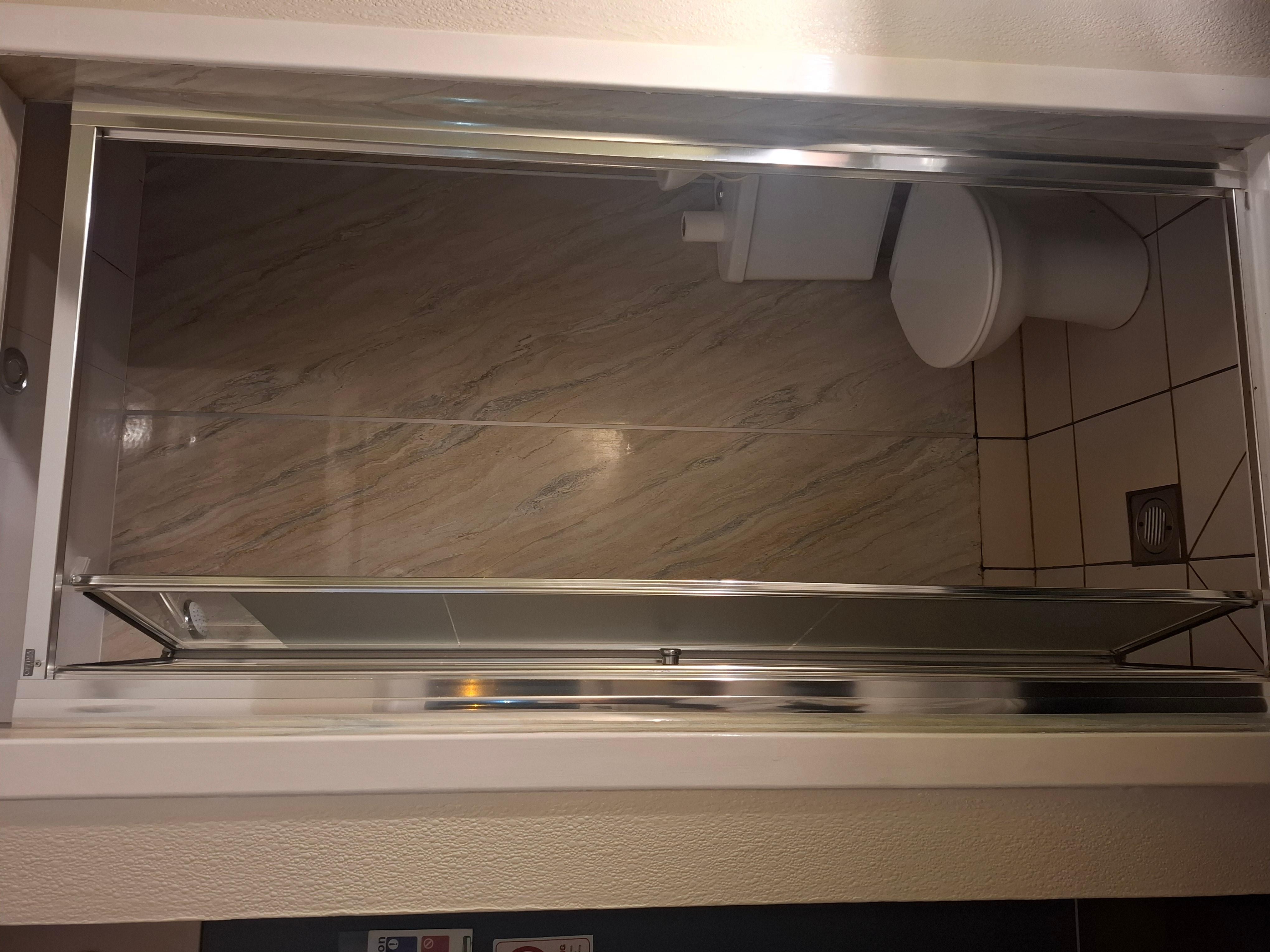 Toilet within the shower cubicle