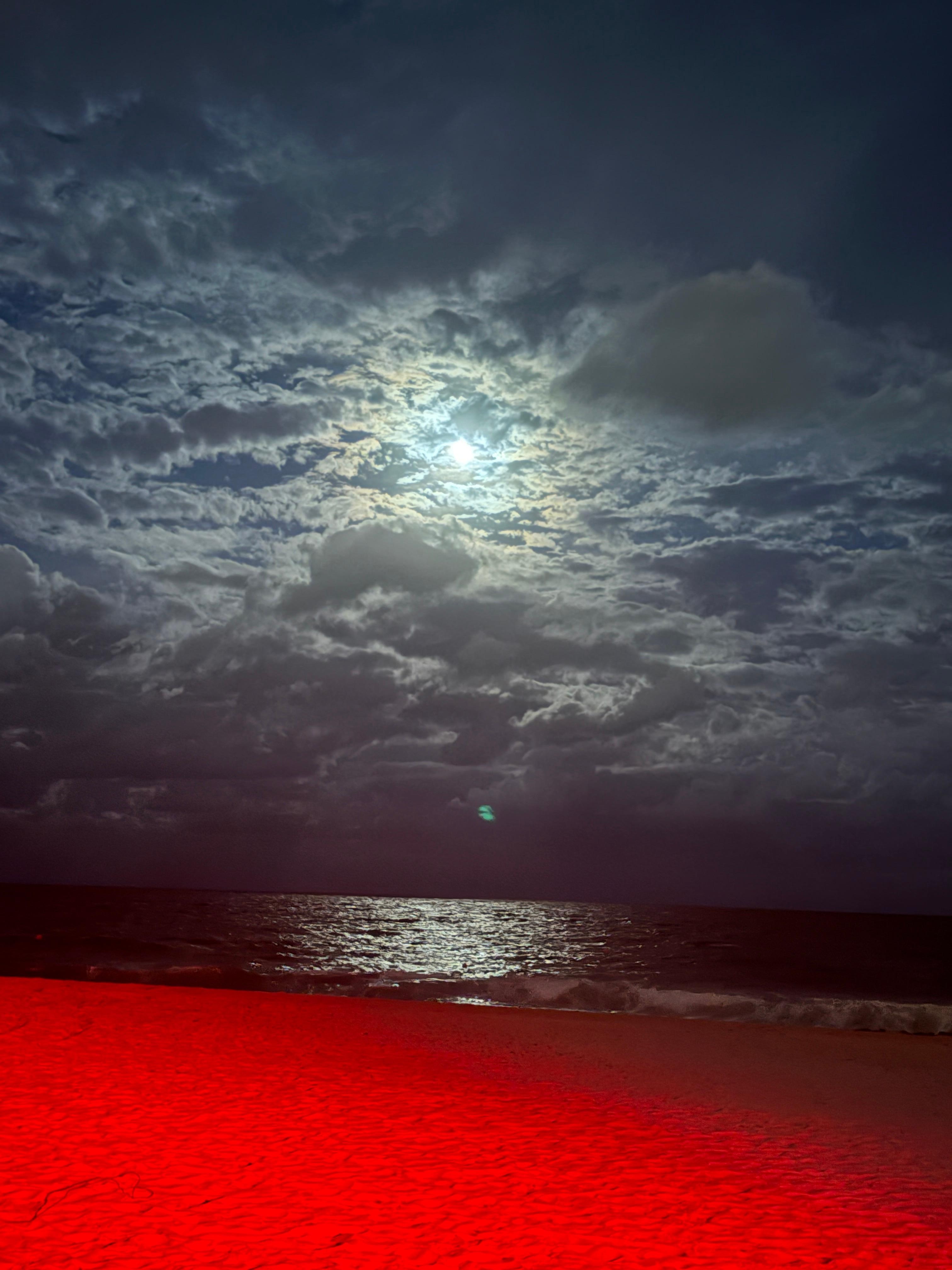 Photo from deck. Red light glow because red lights used by beachfront I  hotels to protect sea turtle hatching!