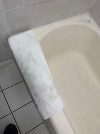 Dirty bath mat, ignoring the shower