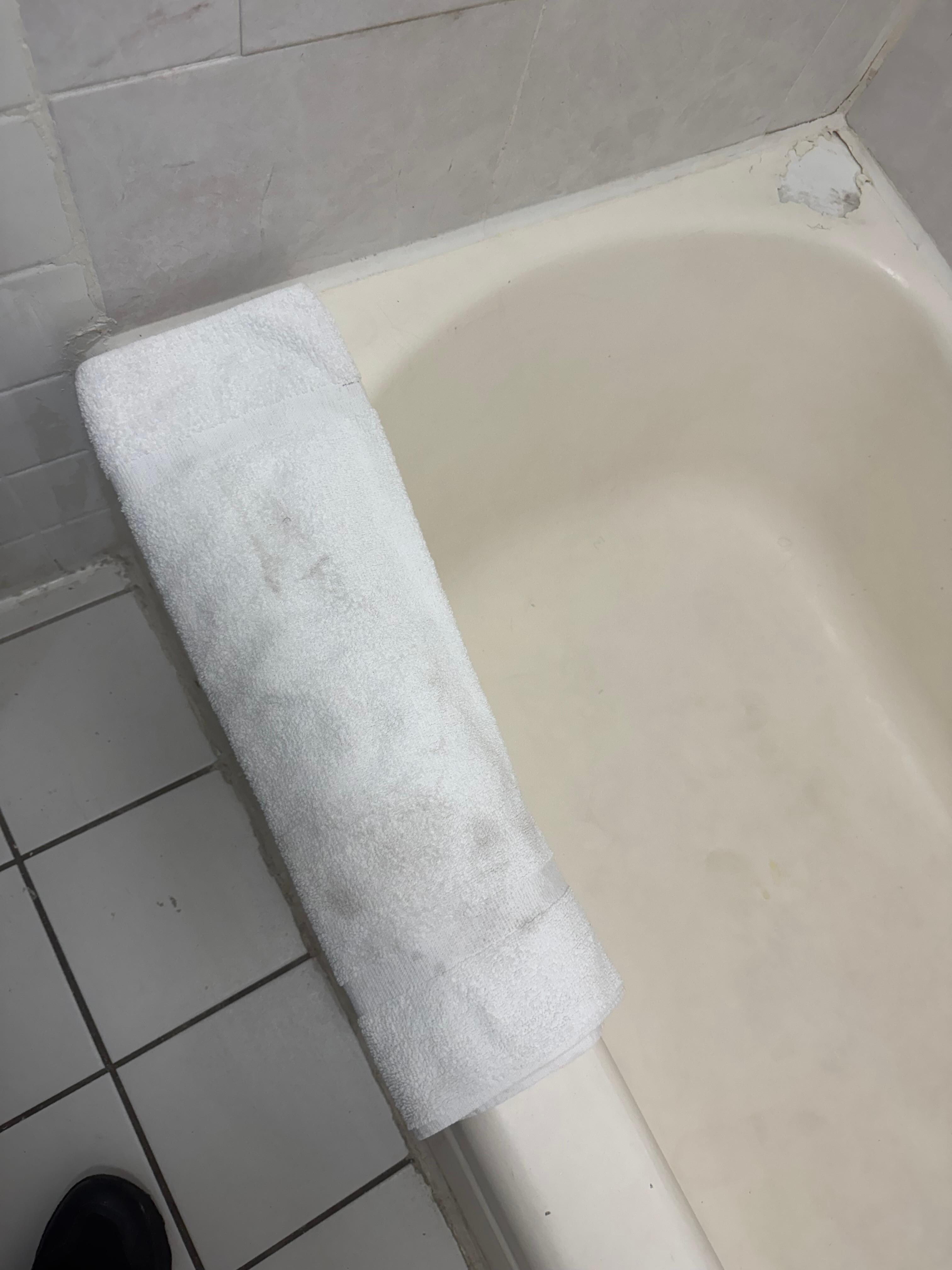 Dirty bath mat, ignoring the shower 