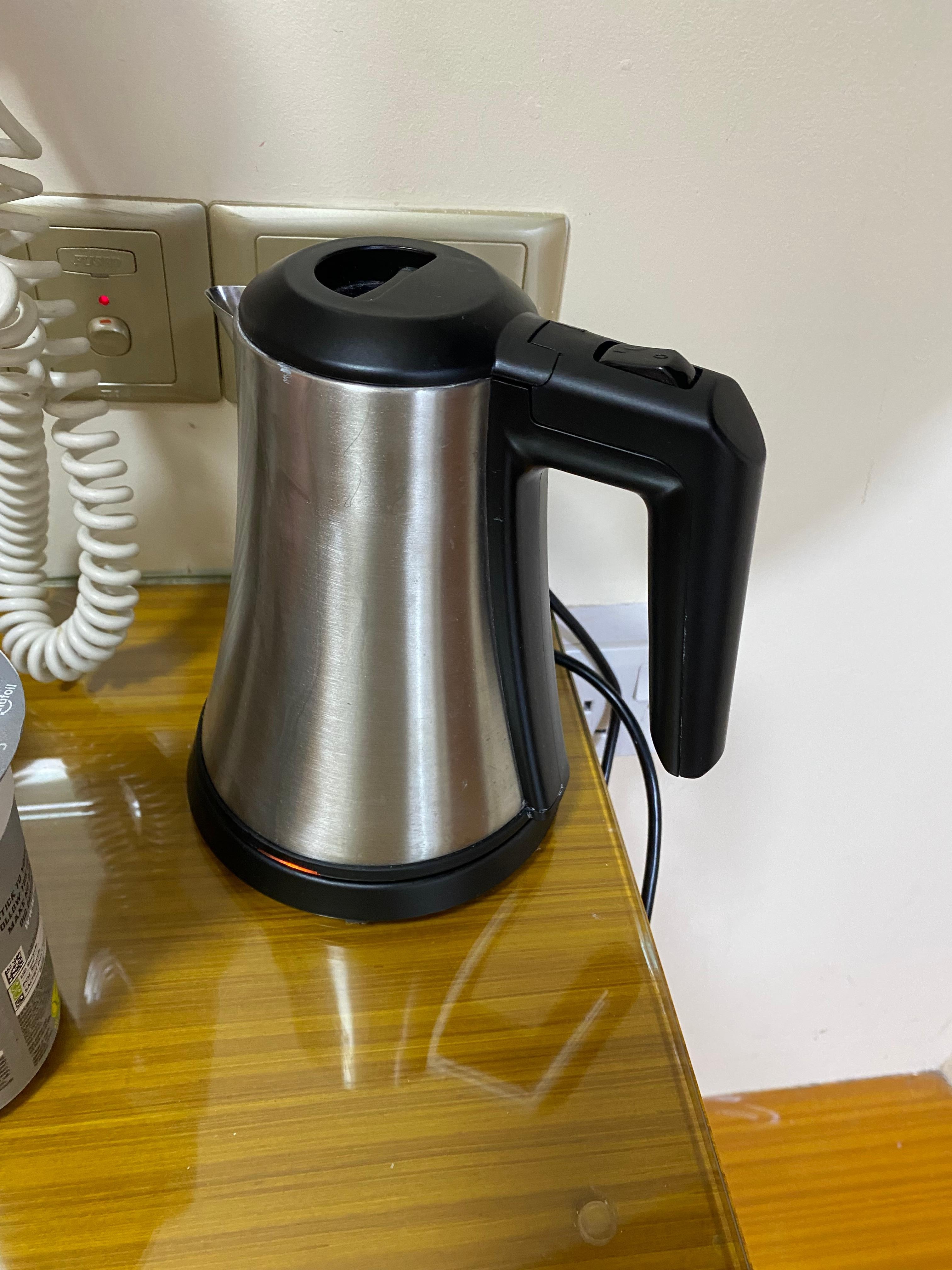 Kettle which spilled over when I boiled it, located next to a hairdryer which was handy.