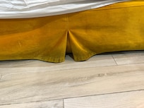 Stains on bedskirt.