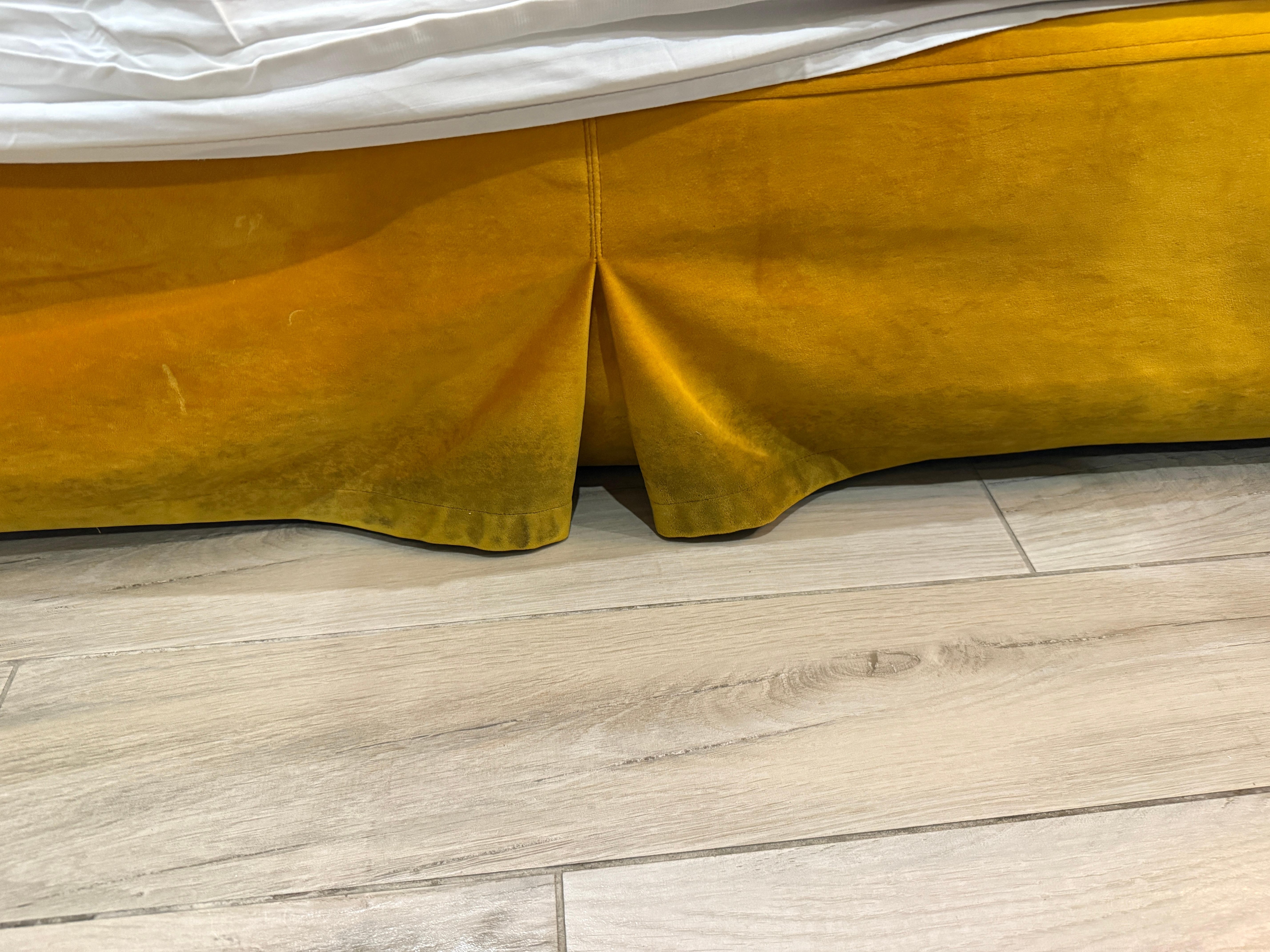 Stains on bedskirt.