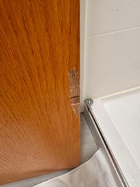 Door chipped from hitting the toilet
