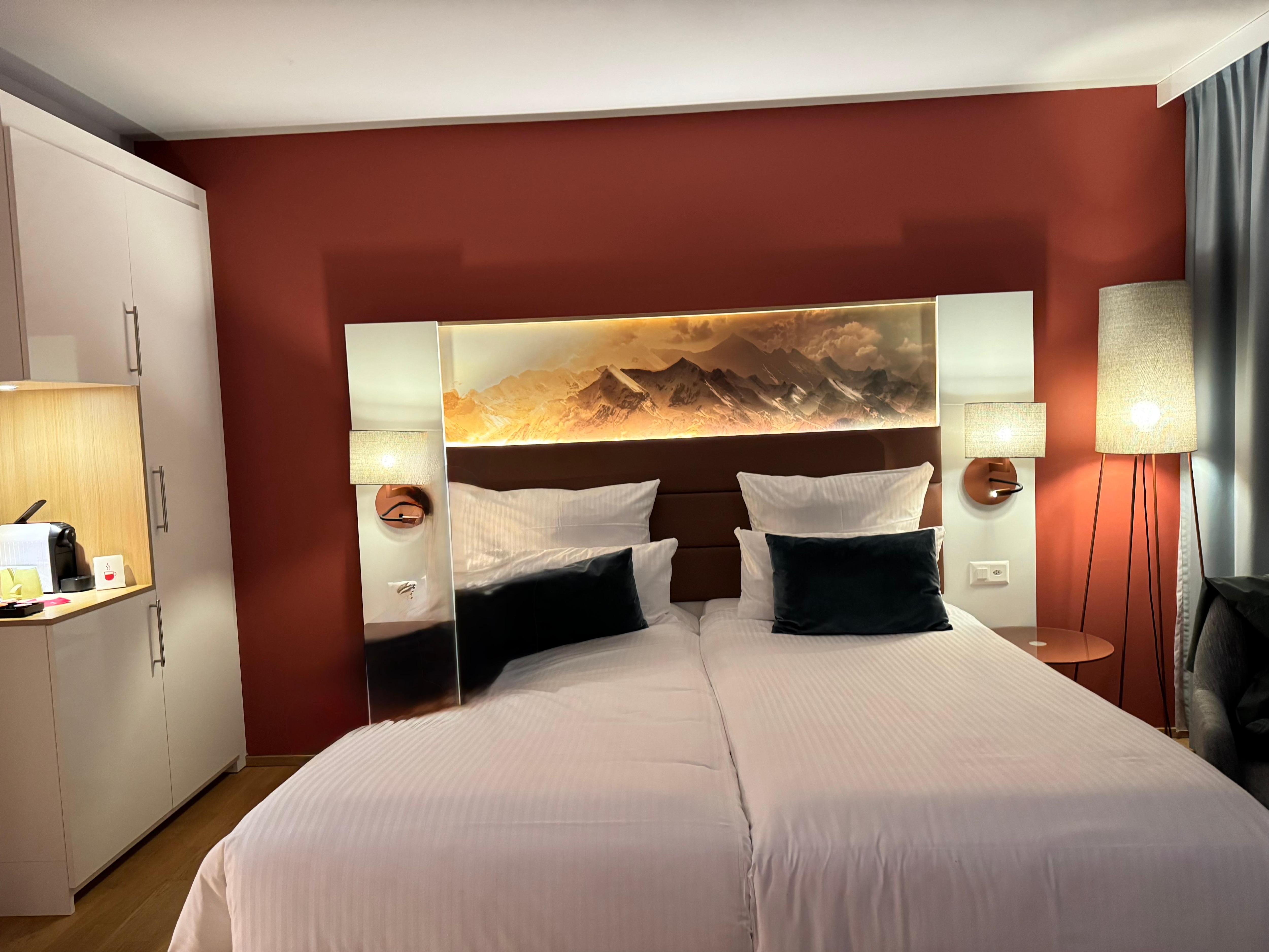 Our room with Alps picture over bed. 