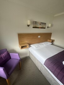 Cheap head-rest that did nothing. No power points next to the bed.
And of course the bed didn’t even touch the wall.