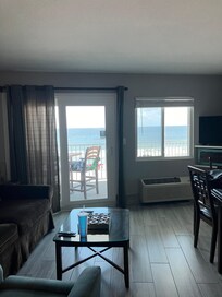 In the living room looking out onto the balcony/ocean.